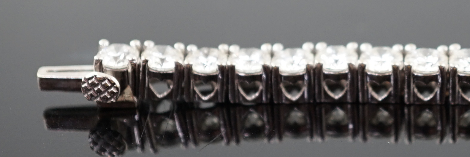 An 18k white gold and diamond line bracelet